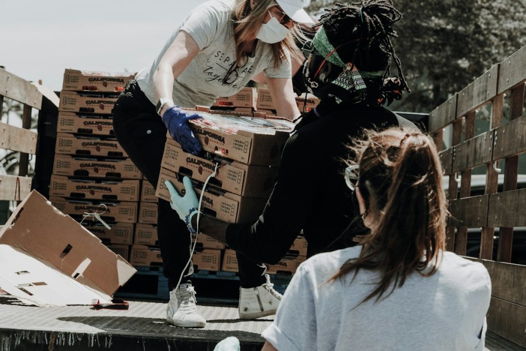 Volunteers preparing food and community supplies